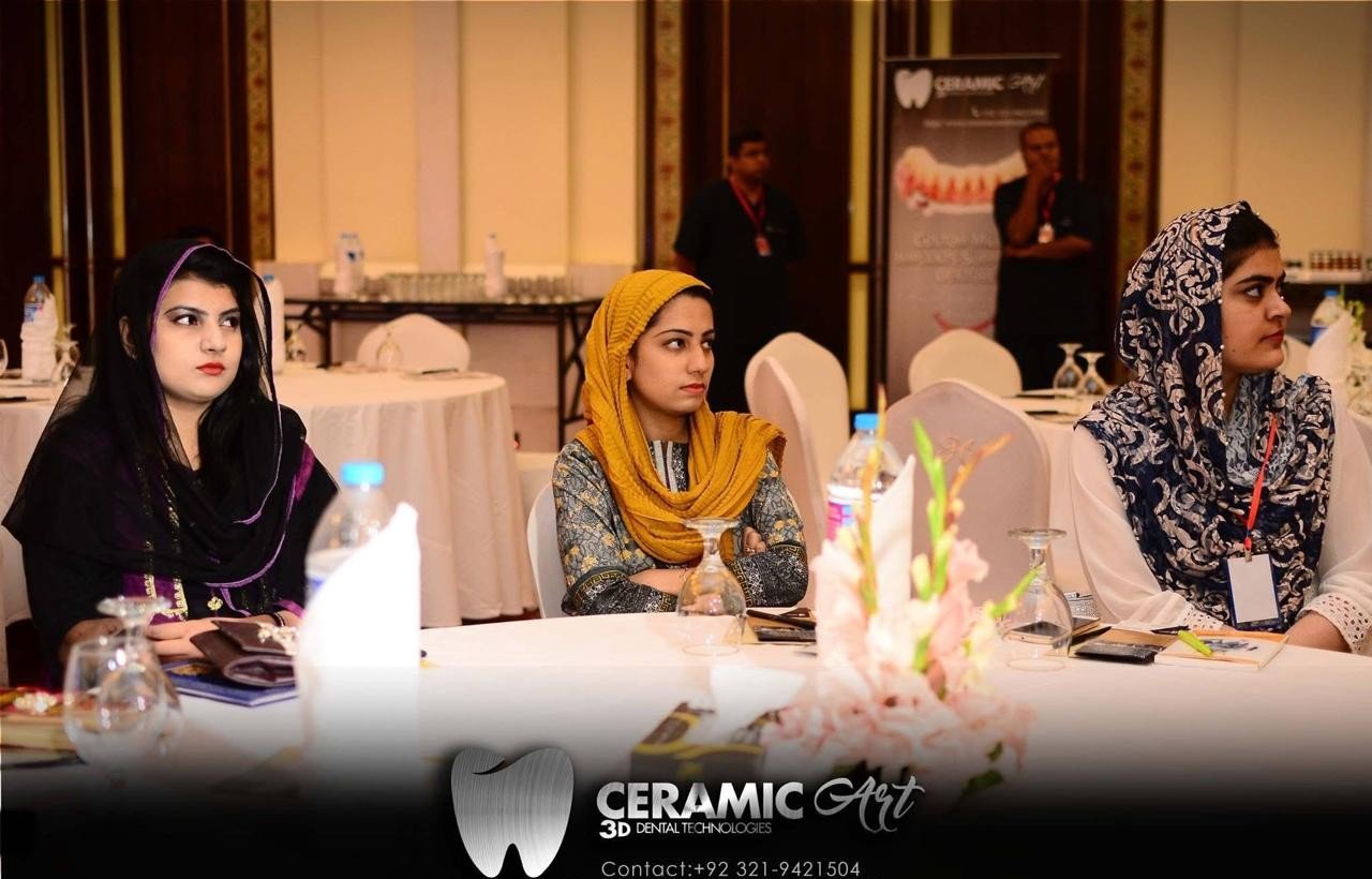 Attendees seated at the Ceramic Art 3D session, branded banner behind them